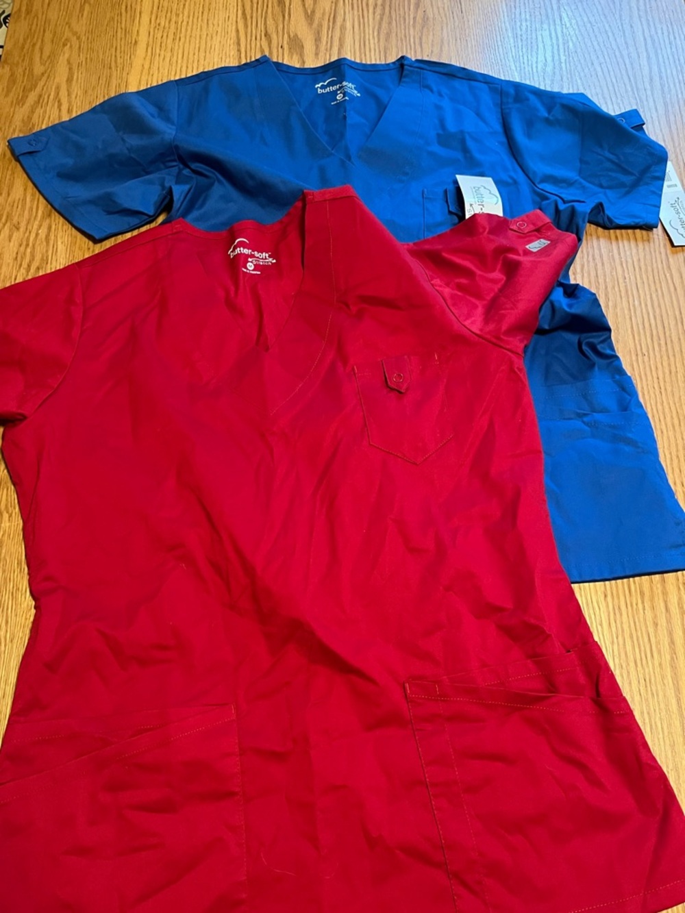 2 Women’s NWT Buttersoft Brand Scrub Tops Size Medium. Red and Blue